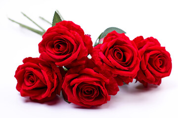 bouquet of artificial red roses on a white background