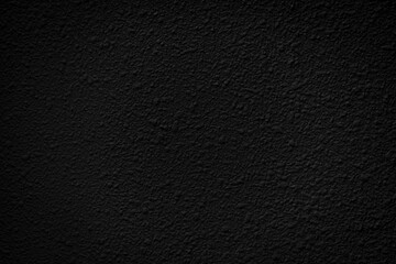 a black background with a rough, irregular texture.