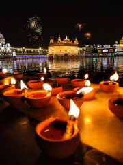 Golden Temple Amritsar lit by Diya and fire crackers Guru Purab festival and Diwali  - 362838871