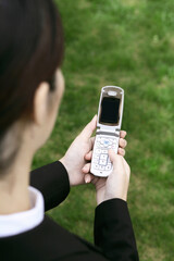 Businesswoman text messaging on the mobile phone