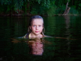 Fototapeta premium mermaid girls with blue eyes and wet hair in dark water