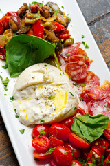 Lobster, mussels, clams and shrimp. Classic Italian restaurant entree favorite. Seafood stew baked in wood fire over and severed with olive oil, lemons and garnished with Italian parsley.