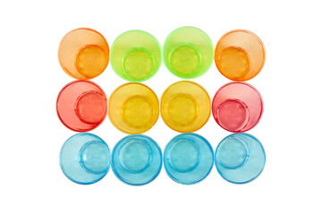 Multi-colored glasses for alcohol and other cold drinks close-up.