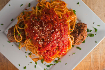 Pasta with meatballs, marinara sauce, Parmesan cheese and fresh Italian parsley. Classic American or Italian restaurant favorite. Homemade pasta with sauces, meats and cheeses.
