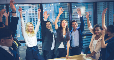 Fototapeta premium success and winning concept - happy business team celebrating victory in co-working space