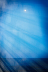 Evening surface of the sea, ocean and moon in the sky.