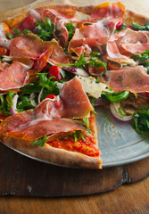 Pizza. Traditional New York City style margarita pizza pie with a thin homemade crispy crust, fresh tomato garlic marinara sauce topped with buffalo mozzarella cheese and fresh basil leaves.