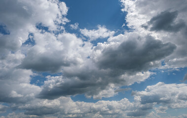 Obraz premium Fluffy clouds in the blue sky sunny day cumulus scape white beautiful cloud.