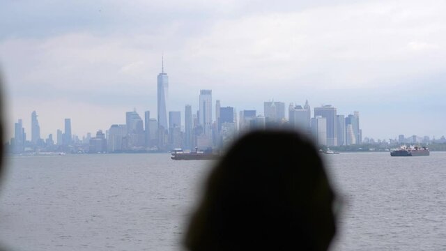 Woman looking at Manhattan panorama in New York City in 4K Slow motion 60fps
