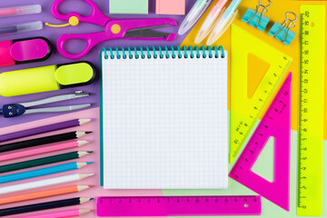 Back to school with stationary and notebook on colorful paper background top view mockup. summer time, creativity and education concept. Mock up, template for text or design