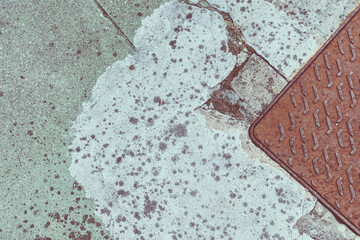 detail of the pavement with metallic rust cover