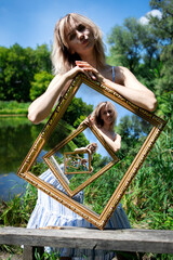 Optical illusion. The composition of an infinite image in a picture. A girl with blond hair on the...