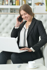 Teen girl in formal wear talking on phone