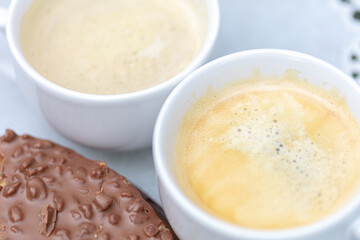 Close-up cups of coffee with chocolate cake