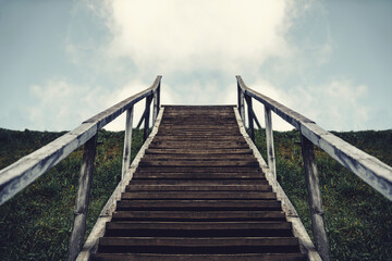 Wooden stairway to sky in against the clouds. Lifestyle wanderlust adventure