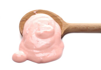 Strawberry fruit yogurt with wooden spoon isolated on white background