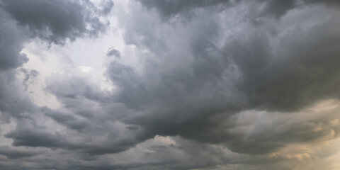panorama of black sky background with storm clouds. thunder front