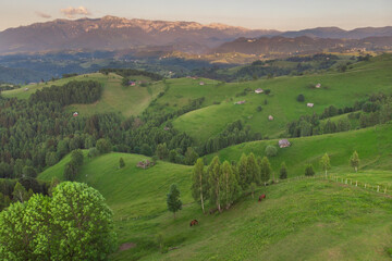 Aerial landscape of beautiful green hills in Transylvania, at the feet of the Carpathians