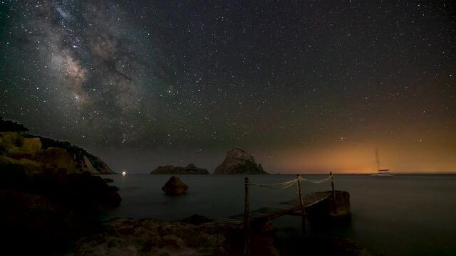 Es Vedra at night with the Milky way. Time lapse 4k. 