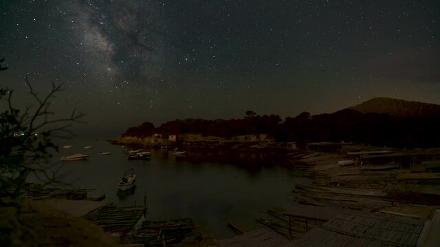 Sa Caleta at night with Milky way. Time lapse 4k.