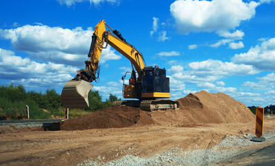 Heavy equipment works in the air. Road reconstruction