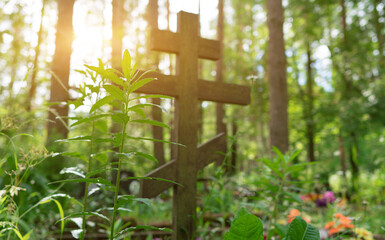 Old forgotten grave in the forest cemetery.