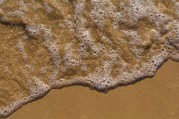 Wet sand on the beach, Pineto, Italy.