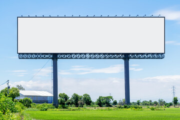 Large billboard mockup stand on green meadow.