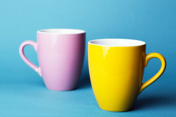pink and yellow cup on a blue background