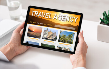 Online Travel Agency Website Opened On Digital Tablet In Female Hands