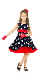 Full Length Portrait of Pretty Girl in Polka Dot Dress