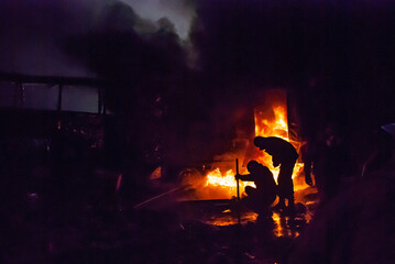 Fototapeta na wymiar Unrest, riots, burning tires, bonfires in the night