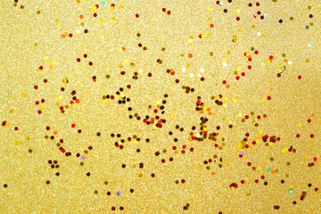 yellow and red sparkles on a gold background