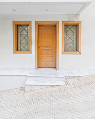 elegant family house wooden door and windows by the sidewalk, Athens Greece