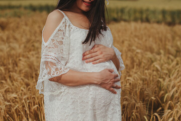 pregnant women in a wheat field