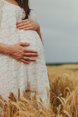 pregnant woman in a wheat field