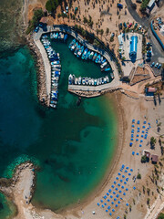 Amazing aerial view over one of the best beaches in Protaras, Cyprus. Yellow sand, blue and turquoise water - perfect summer getaway, luxury vacation in Mediterranean 