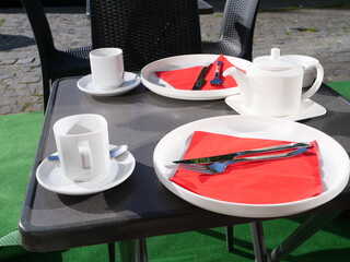 A table outside on a terrace.