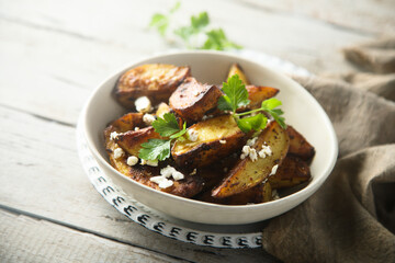 Roasted potato wedges with Feta cheese