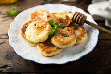 Homemade cottage cheese cakes with honey
