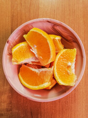 Fototapeta na wymiar sliced orange on a plate