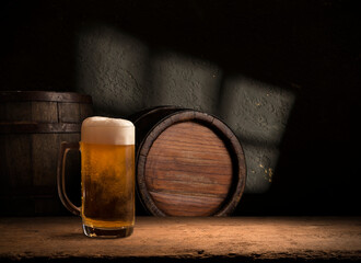 Beer style- bottle, beer in the glass and covers on wooden table. Free space for text. Top view