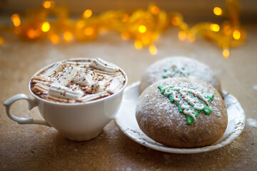 Winter breakfast. Cup of hot chocolate with marshmallows and freshly baked cookies. Gingerbread cookie and coffee.