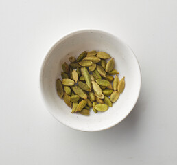 Top view shot of cardamom on white background.