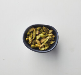 Top view shot of cardamom on white background.