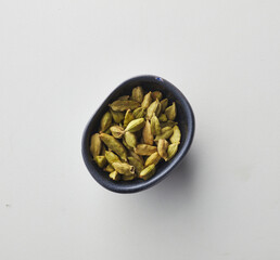 Top view shot of cardamom on white background.