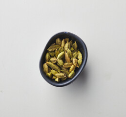 Top view shot of cardamom on white background.