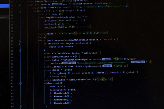 Program code CSS on black background. Computer screen close up. IT or freelance programmer concept. Software develop script on display. Computer Science