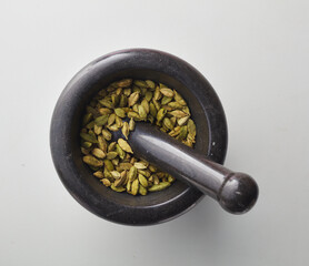 Top view shot of cardamom on white background.