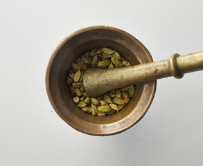 Top view shot of cardamom on white background.